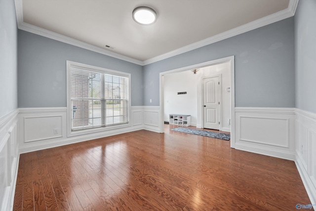11 Nandina Ln SW, Huntsville, AL 35824 - empty room featuring wainscoting, wood finished floors, and ornamental molding