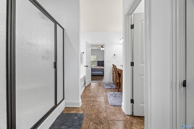 11 Nandina Ln SW, Huntsville, AL 35824 - full bath featuring ensuite bath, a stall shower, tile patterned flooring, a ceiling fan, and baseboards