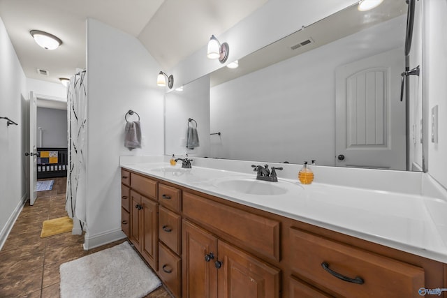 11 Nandina Ln SW, Huntsville, AL 35824 - full bathroom featuring double vanity and baseboards