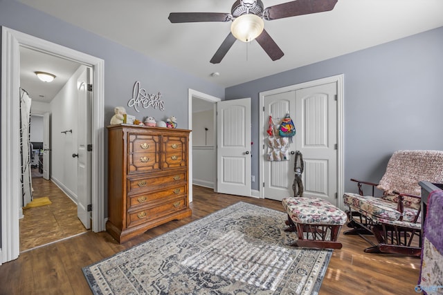 11 Nandina Ln SW, Huntsville, AL 35824 - living area with dark wood-style flooring, a ceiling fan, and baseboards