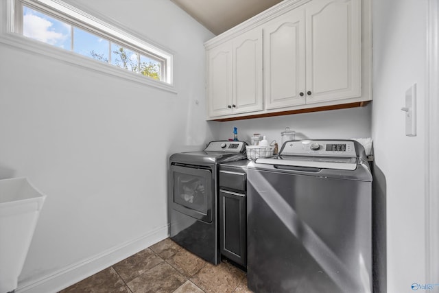 11 Nandina Ln SW, Huntsville, AL 35824 - laundry area with cabinet space, washer and clothes dryer, and baseboards