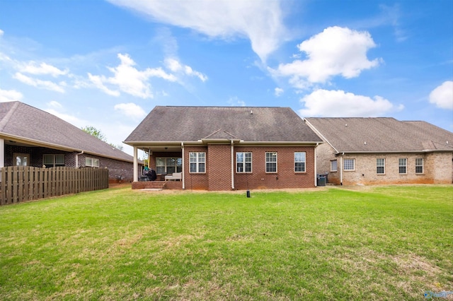 11 Nandina Ln SW, Huntsville, AL 35824 - back of property with brick siding and central AC