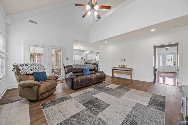 11 Nandina Ln SW, Huntsville, AL 35824 - living room with a ceiling fan, wood finished floors, ornamental molding, vaulted ceiling, and baseboards