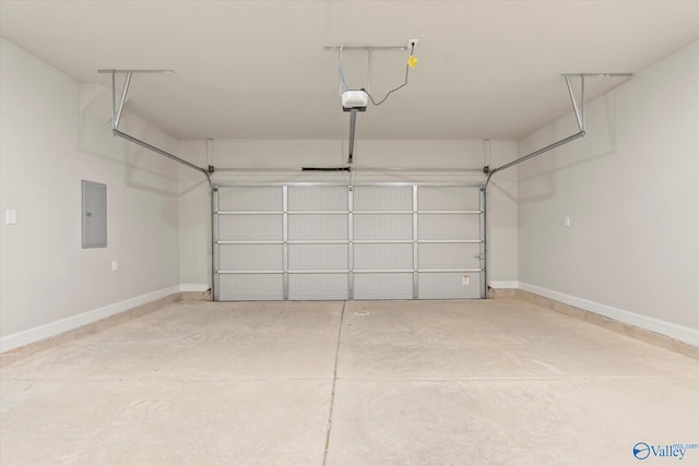 garage with electric panel and a garage door opener