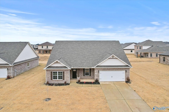 craftsman-style home with a garage and a front yard