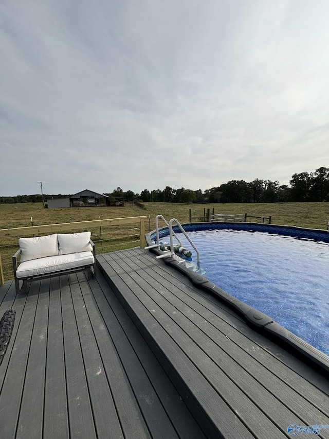 exterior space with a wooden deck and an outdoor pool