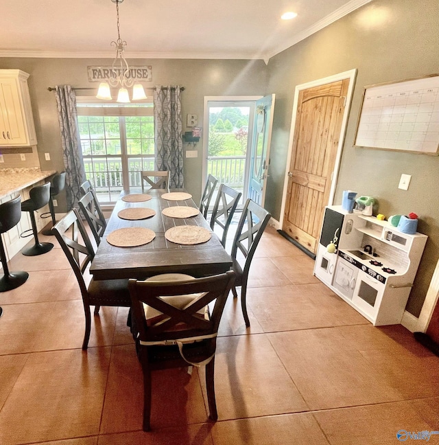 dining space with light tile patterned floors, baseboards, and ornamental molding