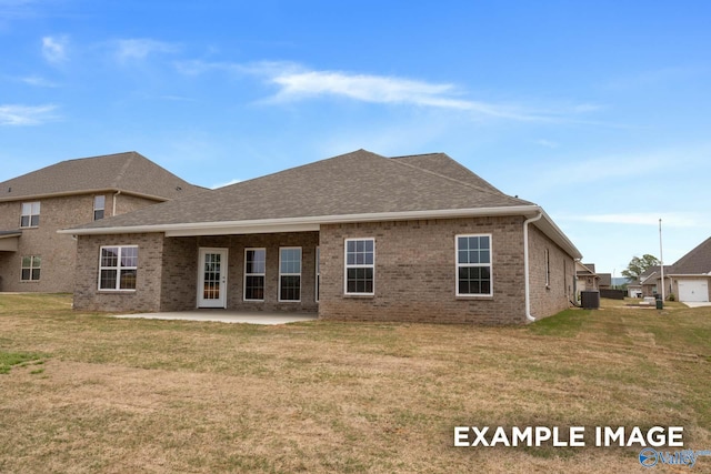 rear view of house featuring a patio, central AC unit, and a lawn