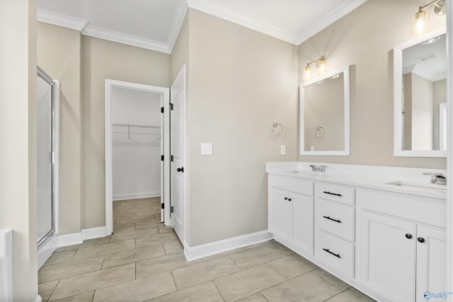 bathroom featuring vanity, a shower with shower door, and ornamental molding