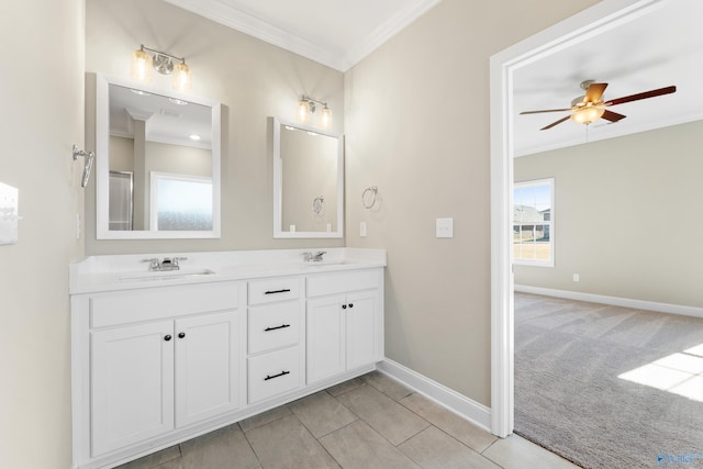 bathroom featuring vanity, crown molding, ceiling fan, and a healthy amount of sunlight