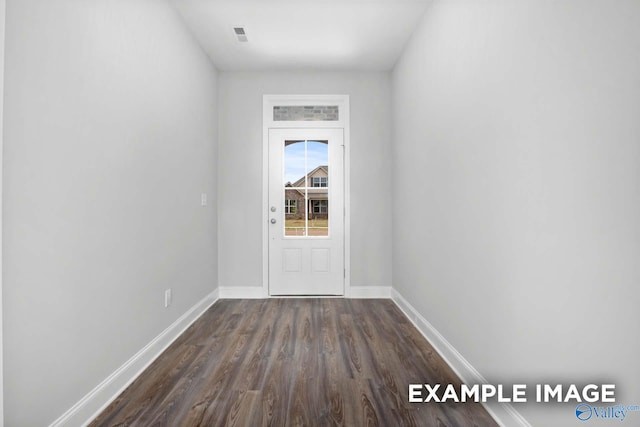 doorway featuring dark hardwood / wood-style floors