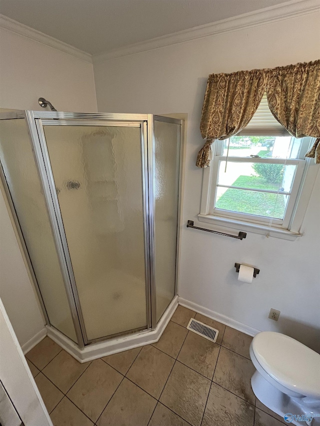 620 Elder St, Boaz, AL 35957 - bathroom with ornamental molding, a stall shower, tile patterned floors, and baseboards