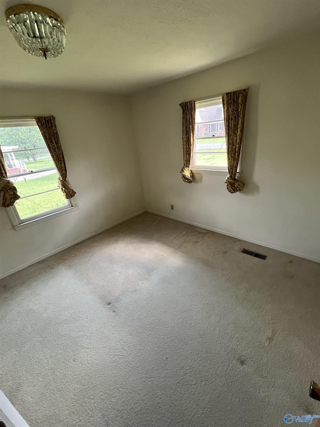 620 Elder St, Boaz, AL 35957 - carpeted empty room with healthy amount of natural light and baseboards