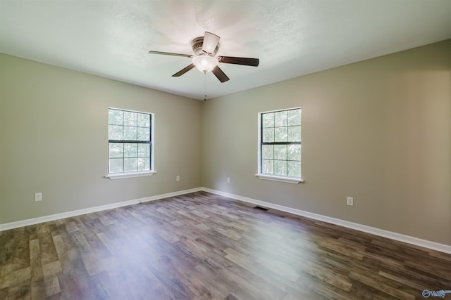 unfurnished room with hardwood / wood-style flooring and ceiling fan