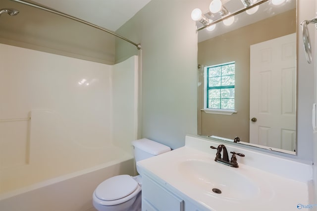 full bathroom featuring bathing tub / shower combination, vanity, and toilet