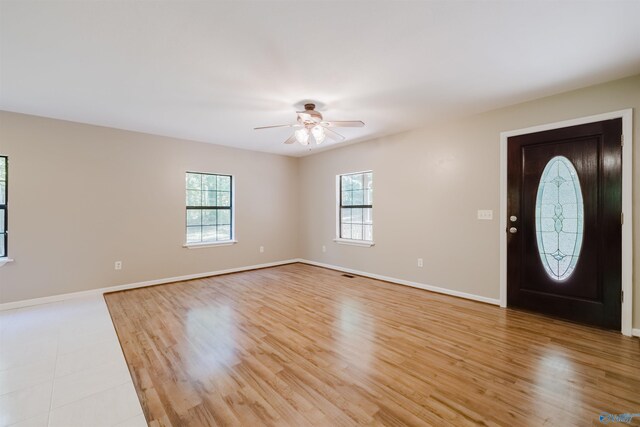 entryway with ceiling fan and light wood-type flooring