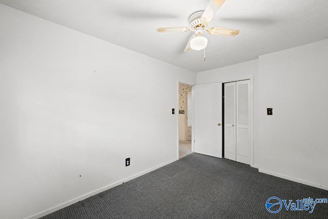 unfurnished room with dark carpet and ceiling fan