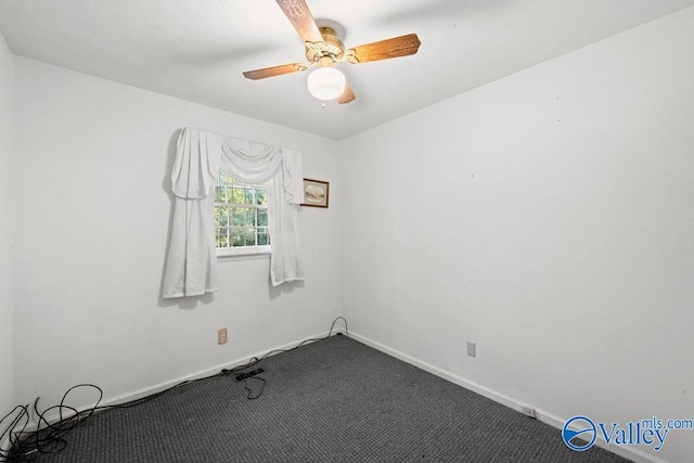 unfurnished room featuring ceiling fan and carpet flooring