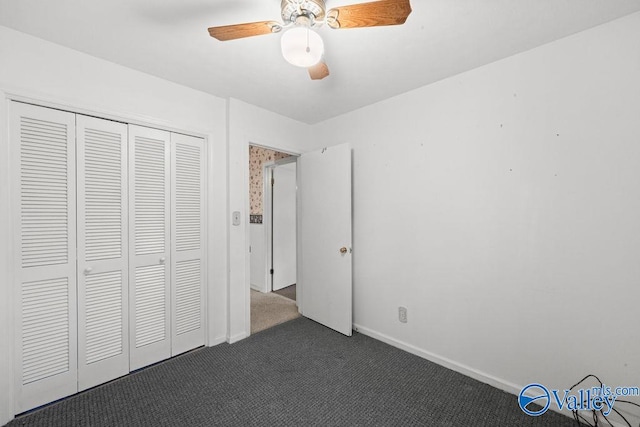 unfurnished bedroom featuring a closet, ceiling fan, and dark carpet