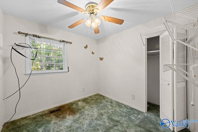 unfurnished bedroom with a closet, carpet floors, and ceiling fan