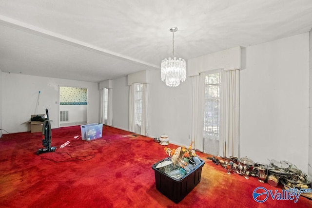 interior space featuring a notable chandelier and carpet flooring