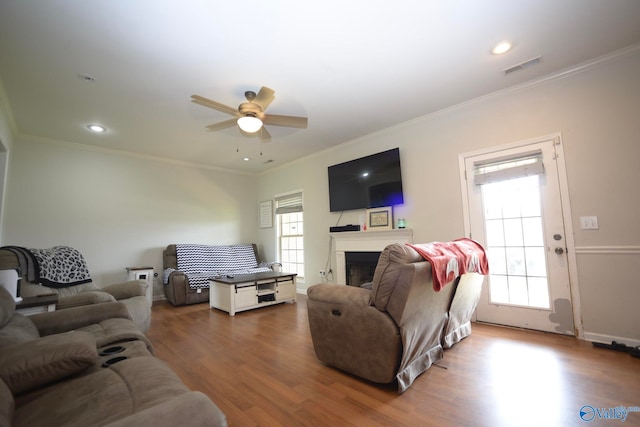 302 Meredith Dr, Muscle Shoals, AL 35661 - living area featuring a ceiling fan, wood finished floors, a fireplace, ornamental molding, and recessed lighting