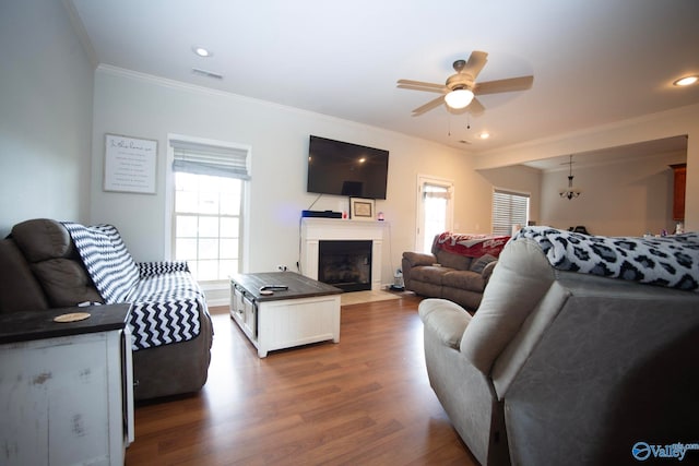 302 Meredith Dr, Muscle Shoals, AL 35661 - living room featuring ceiling fan, ornamental molding, wood finished floors, a fireplace with flush hearth, and recessed lighting