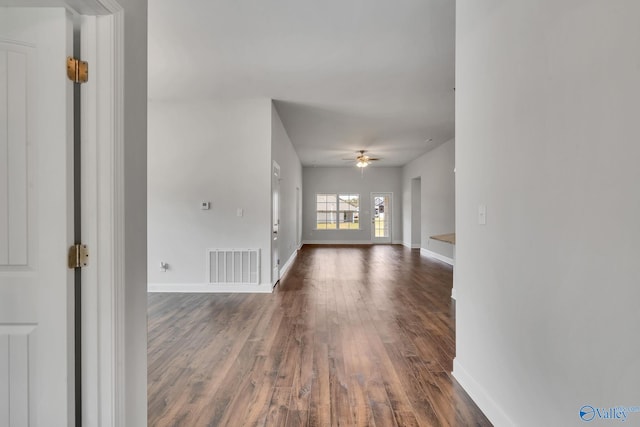 unfurnished room with hardwood / wood-style flooring and ceiling fan