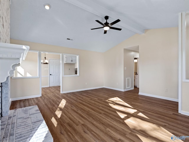 unfurnished living room with ceiling fan with notable chandelier, dark wood-type flooring, and lofted ceiling with beams