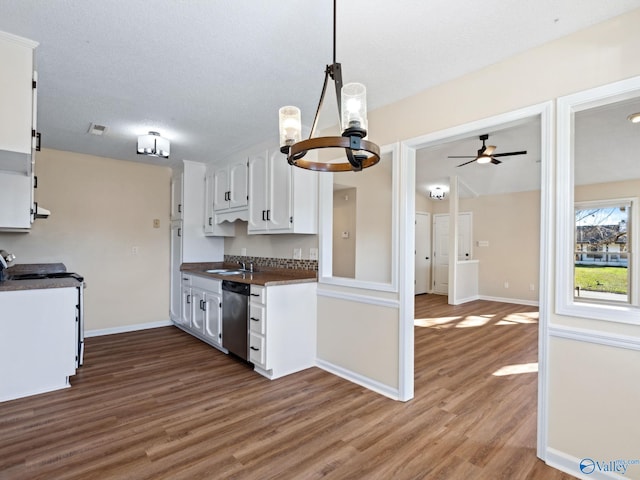 kitchen featuring ceiling fan with notable chandelier, dark hardwood / wood-style floors, white cabinets, and appliances with stainless steel finishes