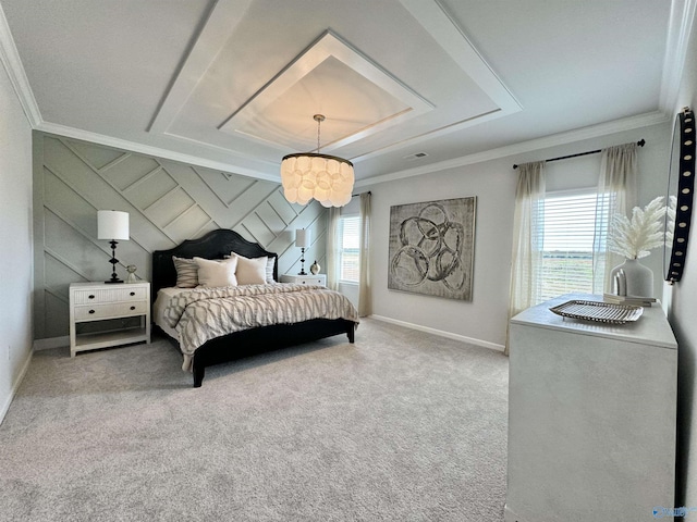 carpeted bedroom with visible vents, a raised ceiling, baseboards, and ornamental molding