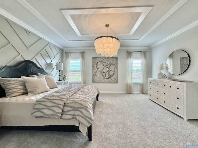 bedroom with a raised ceiling, crown molding, baseboards, and carpet floors