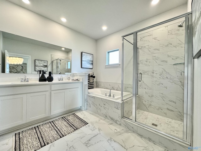 full bath with a garden tub, double vanity, marble finish floor, and a marble finish shower