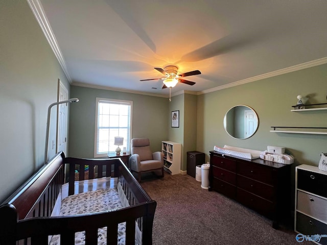 bedroom with carpet floors, a nursery area, crown molding, and ceiling fan