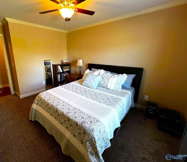 carpeted bedroom featuring ornamental molding, ceiling fan, and baseboards