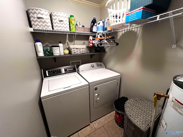 laundry room with laundry area, separate washer and dryer, light tile patterned flooring, and electric water heater