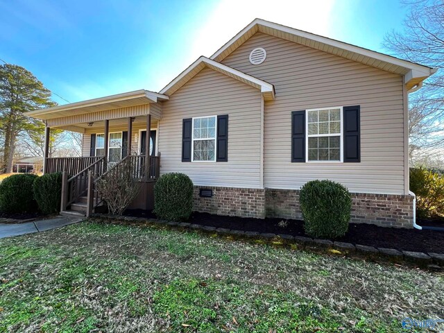 view of front of house with a porch and crawl space