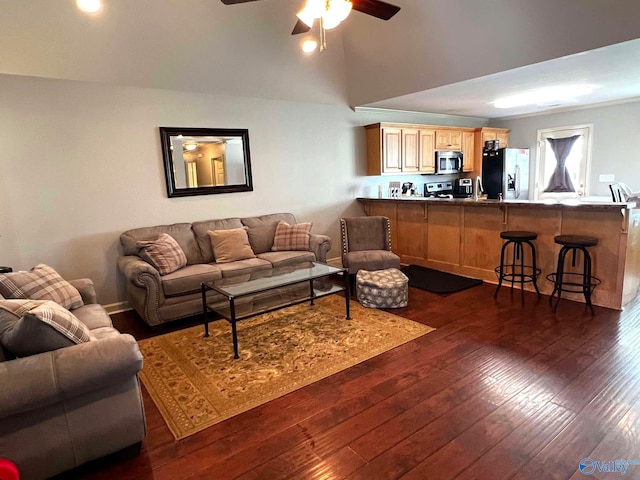 living room featuring ceiling fan and dark wood-style flooring