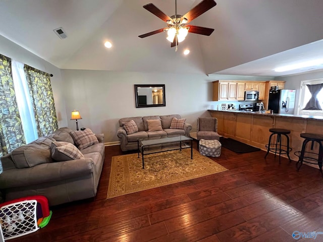 living room featuring high vaulted ceiling, visible vents, baseboards, a ceiling fan, and dark wood finished floors