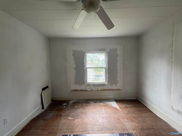 unfurnished room with ceiling fan and hardwood / wood-style flooring