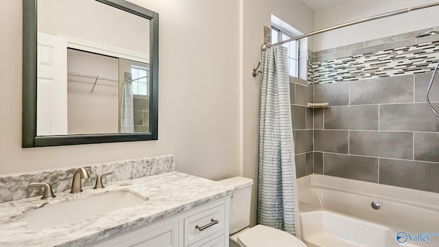 full bathroom with toilet, shower / tub combo, and vanity