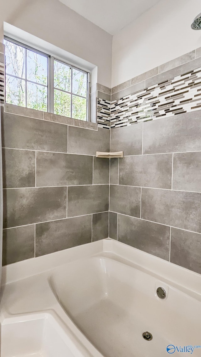 full bathroom featuring a tub to relax in