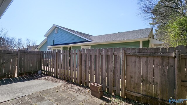 view of patio featuring fence