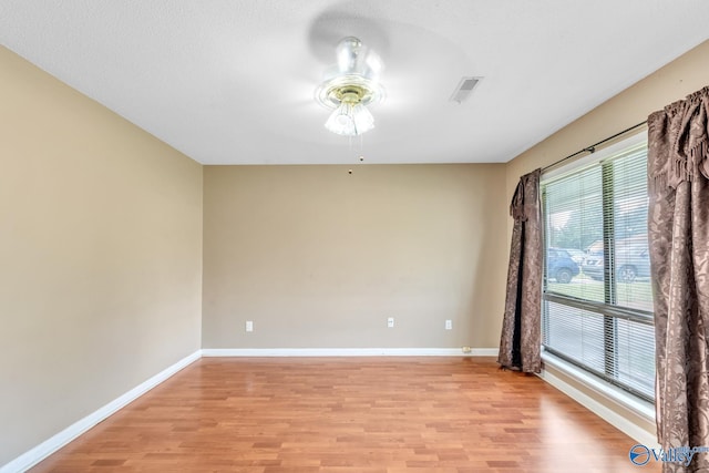 3104 Sandlin Rd SW, Decatur, AL 35603 - unfurnished room featuring ceiling fan, light wood finished floors, and baseboards