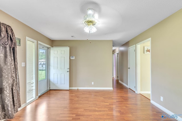3104 Sandlin Rd SW, Decatur, AL 35603 - entryway featuring ceiling fan, light wood-style flooring, and baseboards