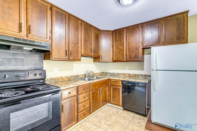 3104 Sandlin Rd SW, Decatur, AL 35603 - kitchen with black appliances, under cabinet range hood, a sink, light tile patterned floors, and tasteful backsplash