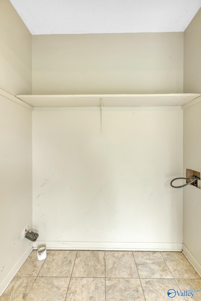 3104 Sandlin Rd SW, Decatur, AL 35603 - washroom with washer hookup, light tile patterned floors, and baseboards