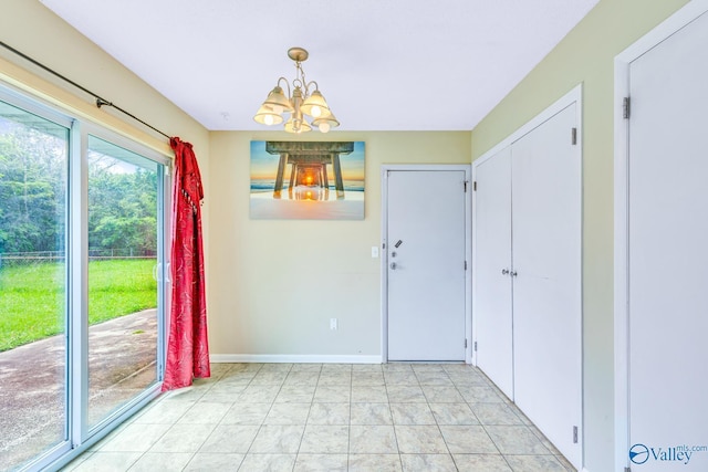3104 Sandlin Rd SW, Decatur, AL 35603 - unfurnished dining area featuring a chandelier and baseboards