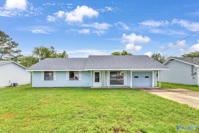 3104 Sandlin Rd SW, Decatur, AL 35603 - ranch-style home with concrete driveway, a garage, a front yard, roof with shingles, and central AC