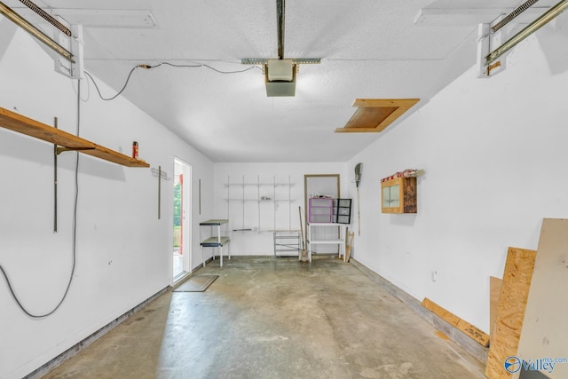 3104 Sandlin Rd SW, Decatur, AL 35603 - garage featuring a garage door opener and baseboards